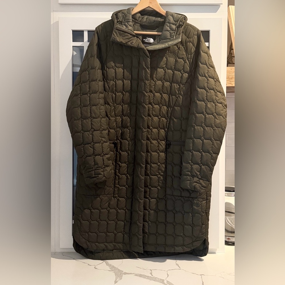 The North Face Women's khaki,modern,minimalist, longer length style.